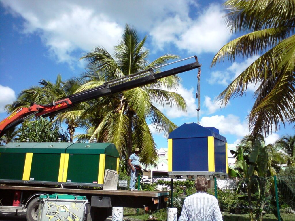 Workers assembling containers during production