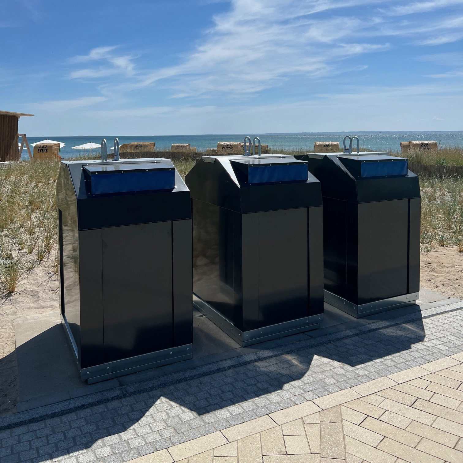 Production of waste containers for municipal waste collection in an industrial manufacturing facility